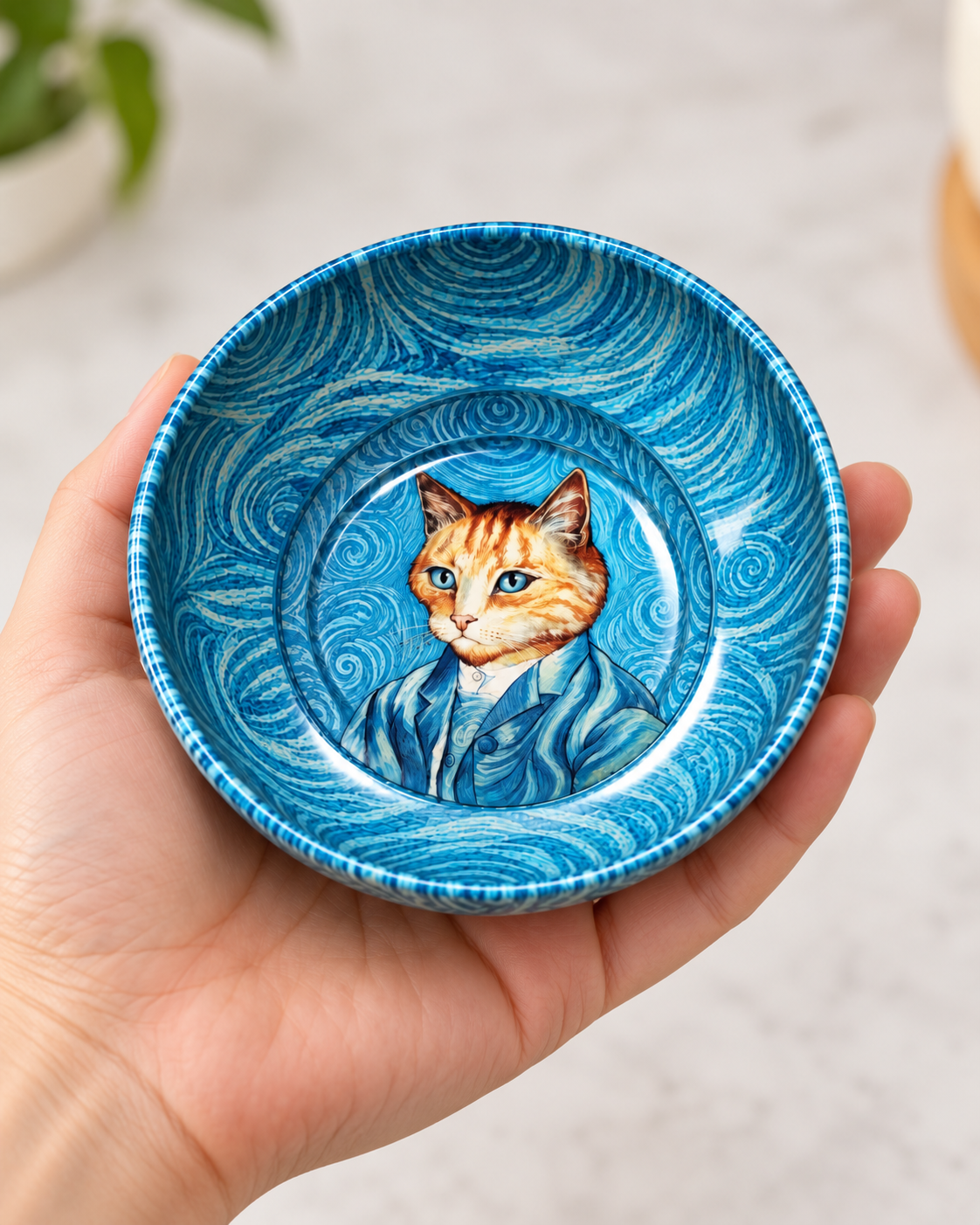 Blue Artist Cat mini steel catch-all by NIVUMA — held in hand for scale