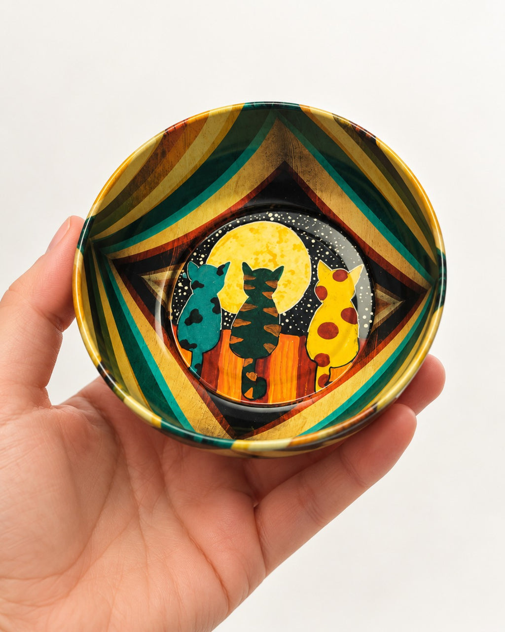 Moonlight Cats mini bowl shown in hand for scale